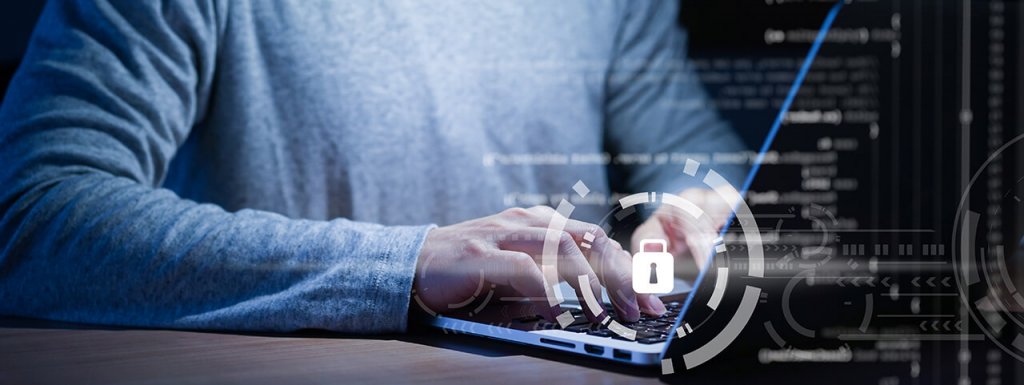 Man working on computer with lock icon over the keyboard